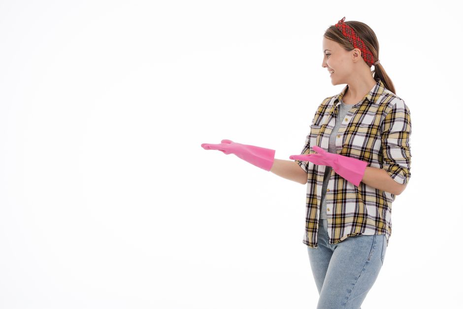Happy professional cleaning expert smiling in a clean home